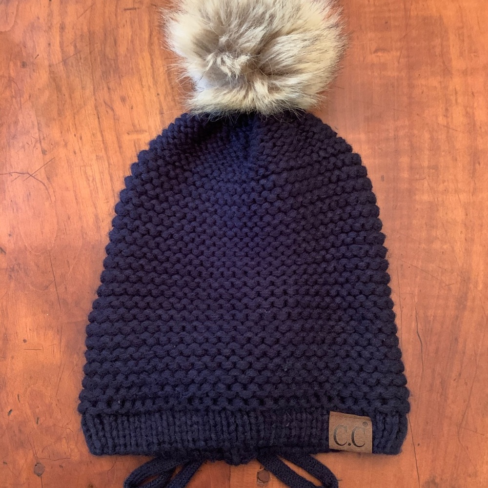SOLD!!!CC beanie hat with furry ball and criss cross tie